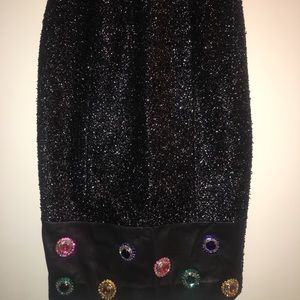 Shimmery black pencil skirt with bejeweled bottom.